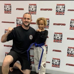 Little girl with her instructor at Tiger Schulmann's Stamford