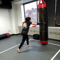 A woman punching bag at Tiger Schulmann's Chelsea