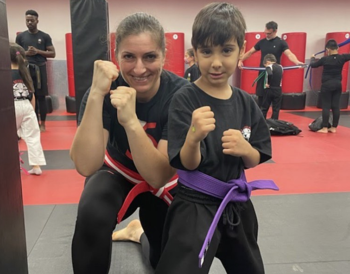 A boy and a lady instructor at kids training in Rego Park
