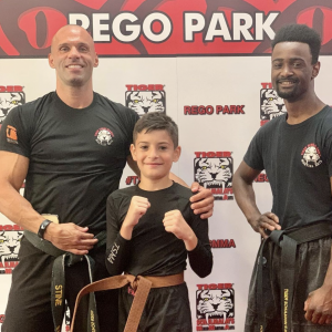 Two martial arts sensei and a boy at Tiger Schulmann's Rego Park
