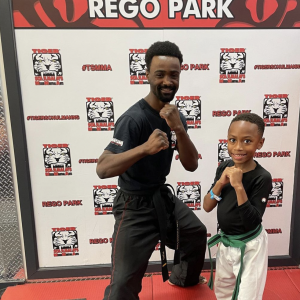 Little boy and his trainer at Tiger Schulmann's Rego Park