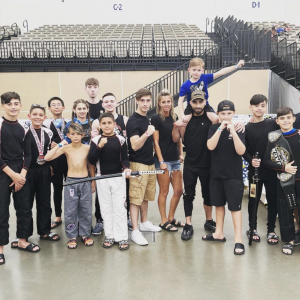 Adults and kids kickboxers outdoors in Tottenville
