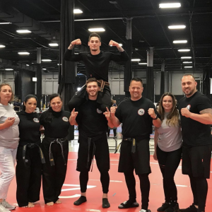 Four male and four female martial arts fighters in Smithtown