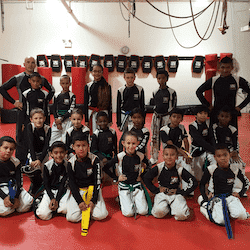 A group of children with martial arts instructors in Yonkers