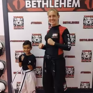 Female instructor and a boy at Tiger Schulmann's in Bethlehem
