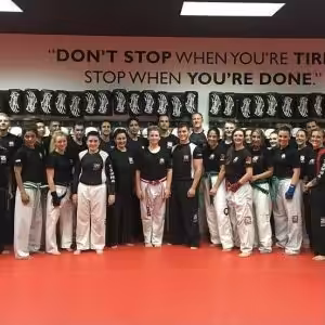 Tiger Schulmann's crew in Bethlehem with motivational quote on a wall