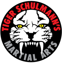 Tiger Schulmann's logo with white tiger head