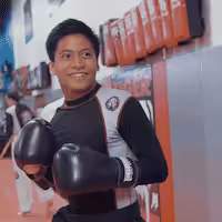 A boy with gloves at Tiger Schulmann's Wayne