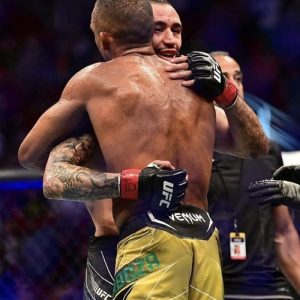 Two UFC fighters hugging after the fight
