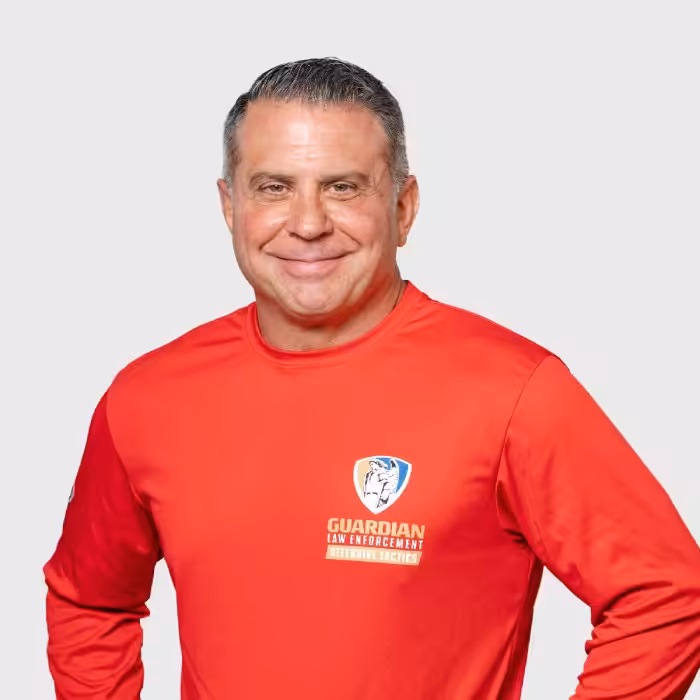 A man in red Guardian sweatshirt