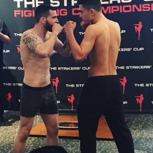Two fighters facing each other with fists raised