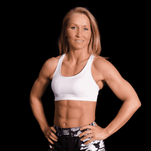 A woman kickboxer in white tank top