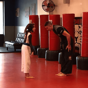 A girl and her instructor bowing at Tigger Schulmann's in Paramus