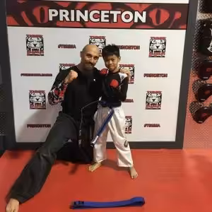 Martial arts instructor with a boy at Tiger Shulmann's in Princeton