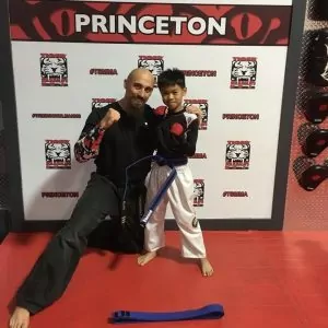 Martial arts instructor with a boy at Tiger Shulmann's in Princeton