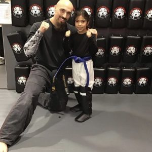 Martial arts instructor with a little girl at Tiger Shulmann's in Princeton
