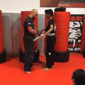 Martial arts instructor and a boy at Tiger Schulmann's in Princeton