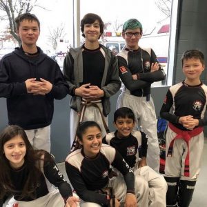 Five boys and two girls in kickboxing gear in Ramsey