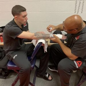 UFC fighter's hands getting prepared for training