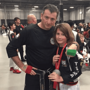 Martial arts instructor with a girl at Tiger Schulmann's in Red Bank