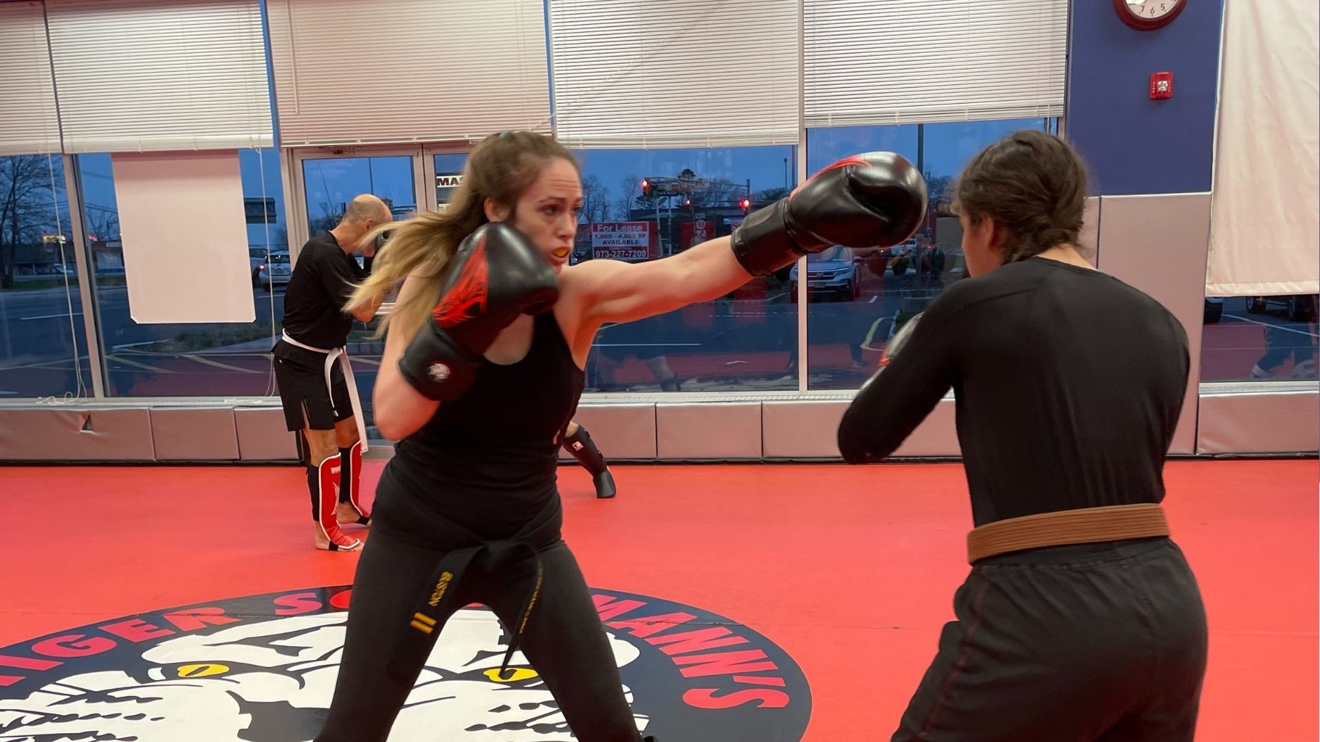 Two Girls Sparring During a Kickboxing Practice at Tiger Schulmann's Brick