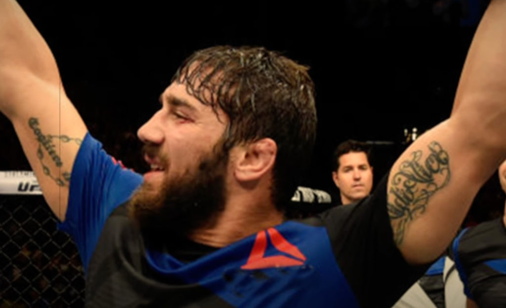 Tiger Schulmann's fighter Jimmie Rivera raising arms victoriously