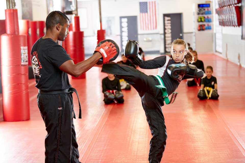 Girl training with her instructor at TSMA