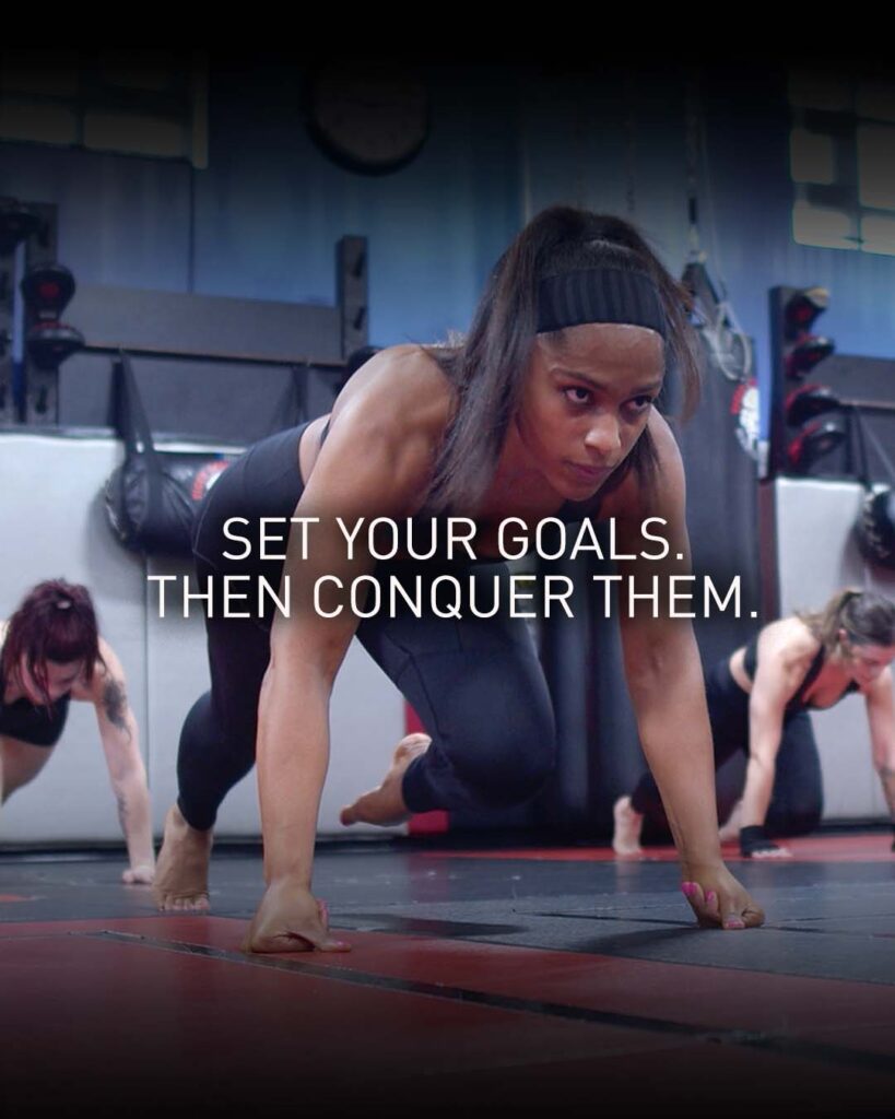 Girl workout with text over it saying "Set your goals. Then conquer them."