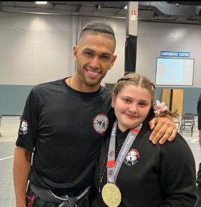 Instructor Juan Vides and girl smiling at TSMA Conference