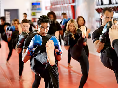 Adult kickboxing workout in TSMA Syosset gym