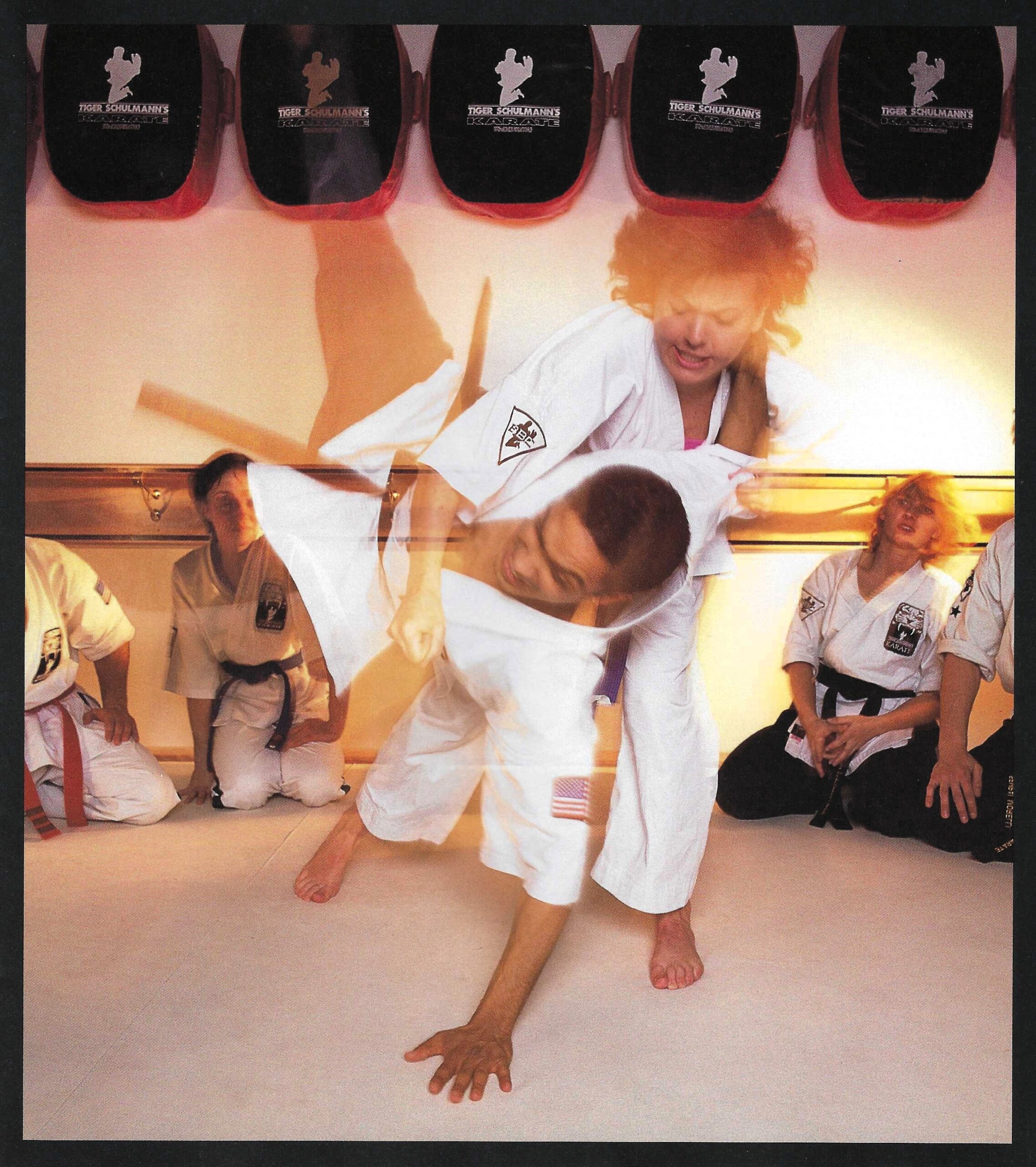 Two children practicing karate.
