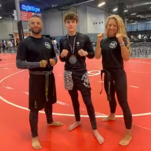 Young TSMA Horsham Kickboxing Student with His two instructors